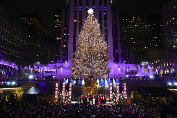 Iconic Christmas tree at Rockefeller Center illuminated AP News